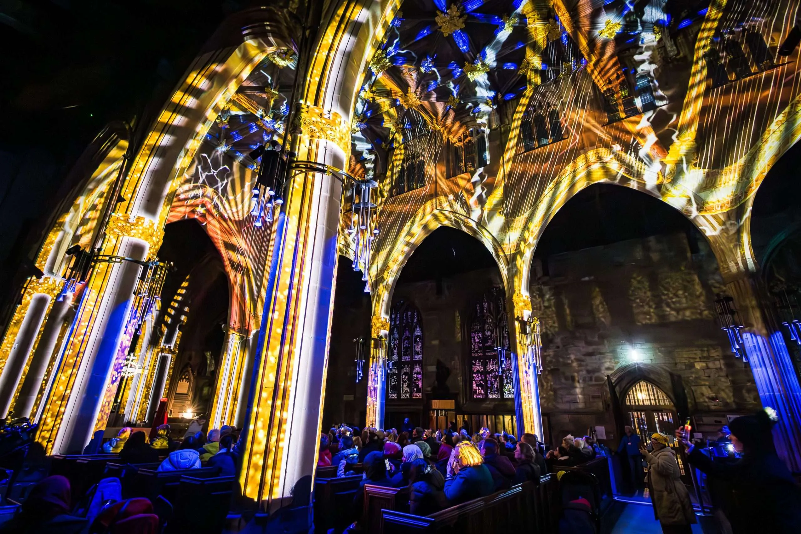 A photo of the inside of Rotherham Minster brightly illunminated.
